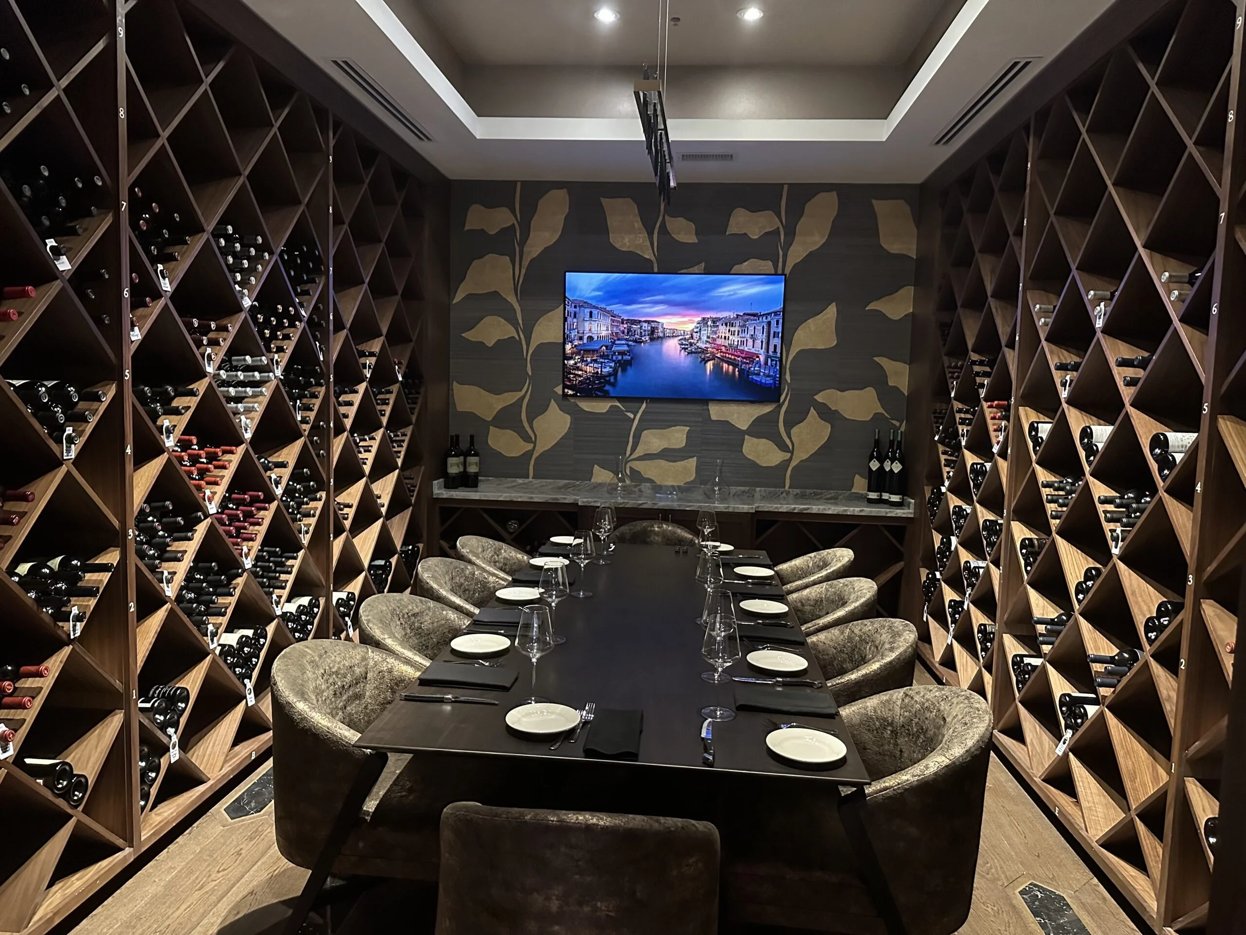 Bob’s Steak & Chop House displays wine around a table for guests
