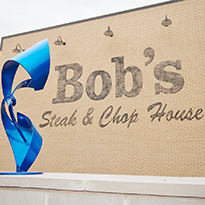 Bob's Steak & Chop House Wall Signage with Art Display at District 121