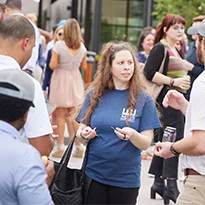 Group of people in the courtyard at District 121 mingling