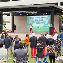 Group of people in the audience at District 121 looking at the stage